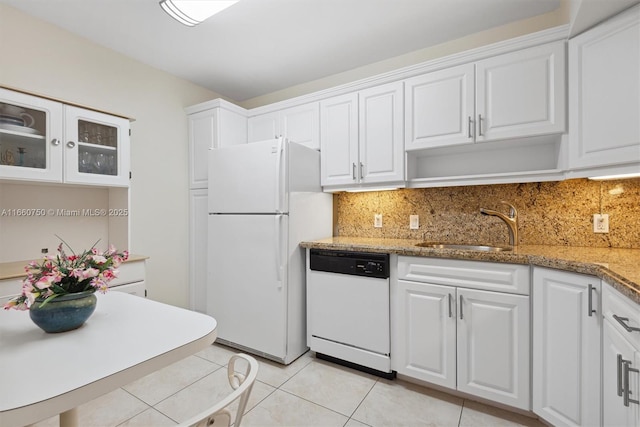 kitchen featuring white cabinets, white appliances, and light stone countertops