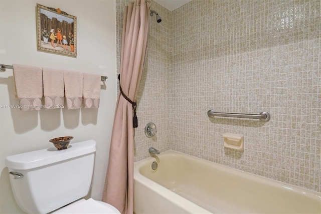 bathroom with shower / tub combo and toilet