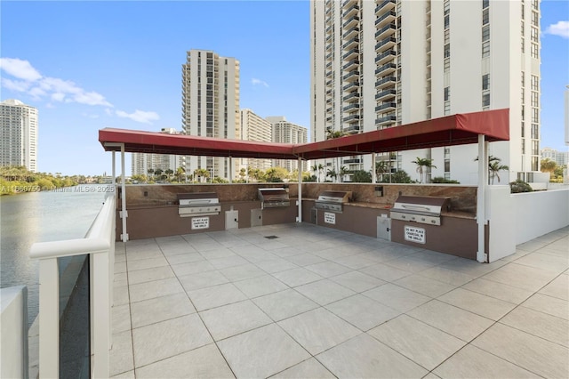 view of patio with a grill and an outdoor kitchen