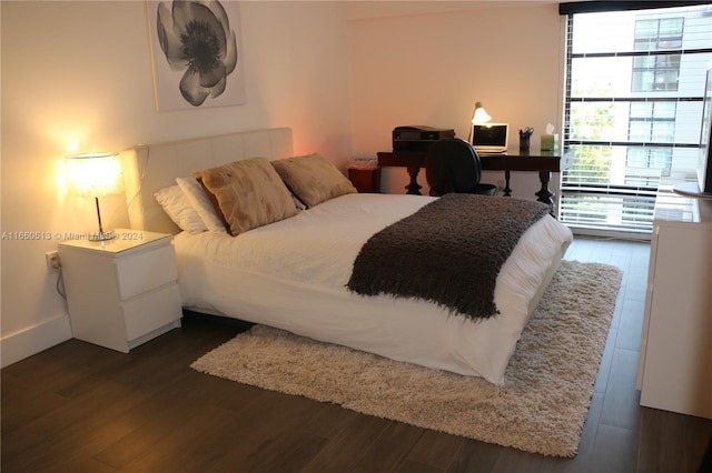 bedroom featuring dark wood-type flooring