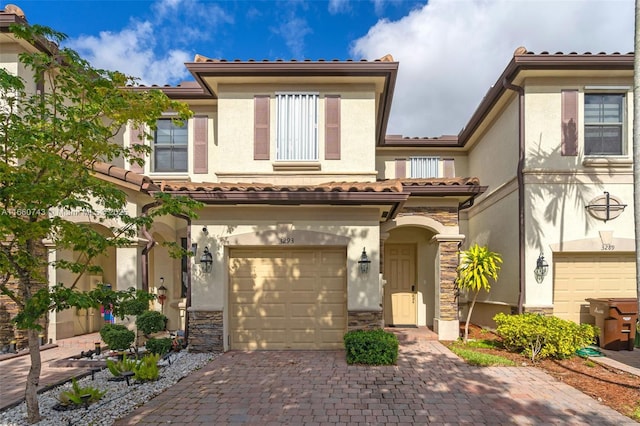 mediterranean / spanish-style home featuring a garage