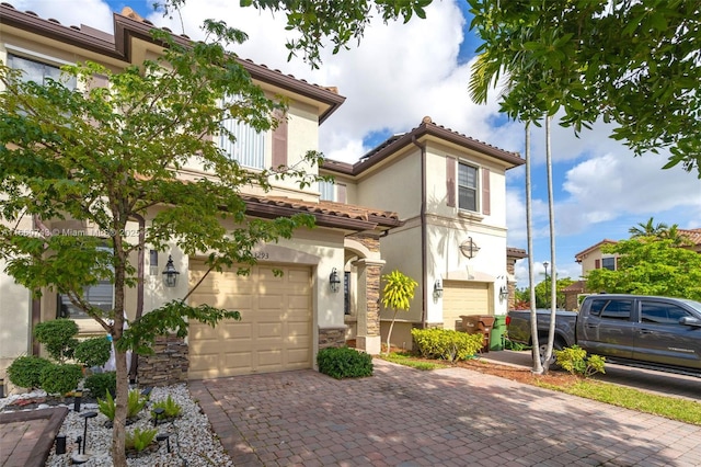 mediterranean / spanish-style home with a garage