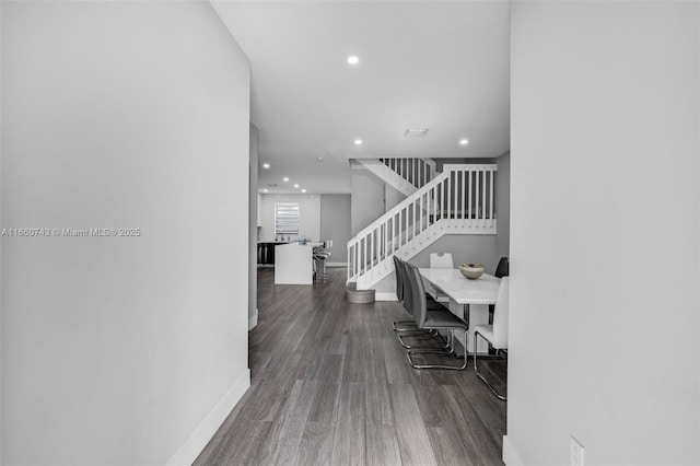 hallway featuring dark hardwood / wood-style floors