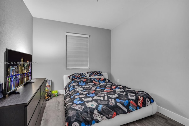 bedroom featuring hardwood / wood-style floors