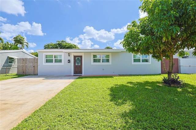 ranch-style house with a front yard