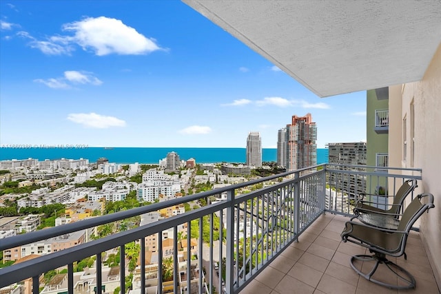 balcony featuring a water view