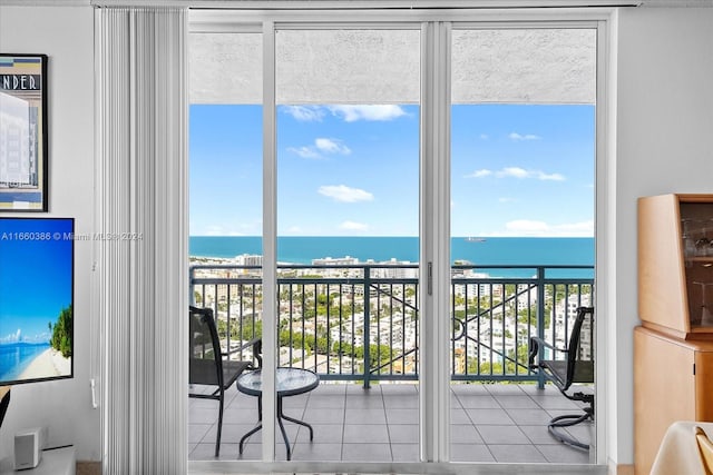 doorway to outside featuring a water view