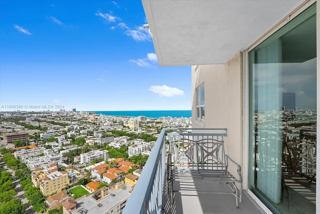 balcony featuring a water view