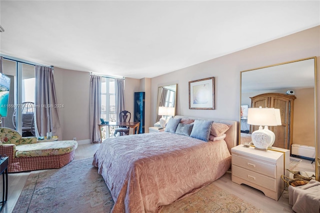 bedroom with light hardwood / wood-style flooring