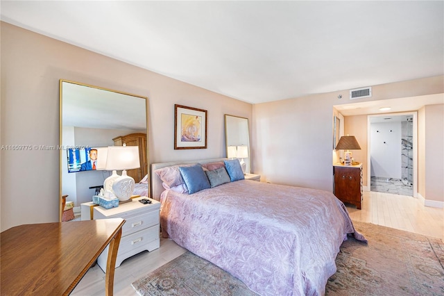 bedroom with light hardwood / wood-style flooring