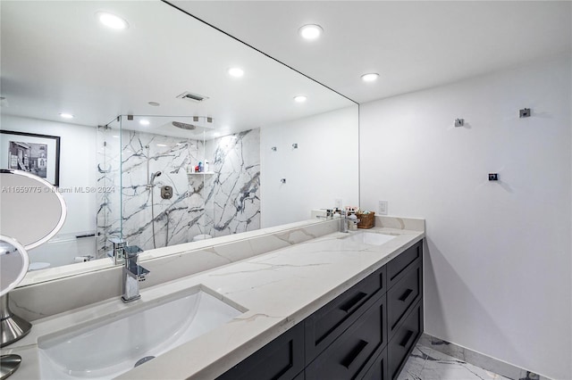 bathroom featuring walk in shower and vanity