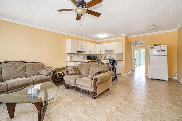 tiled living room with a textured ceiling, ceiling fan, and crown molding