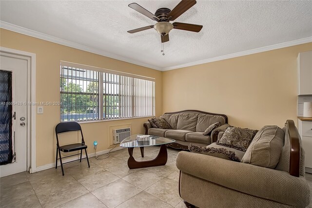 tiled living room with a textured ceiling, ornamental molding, and ceiling fan