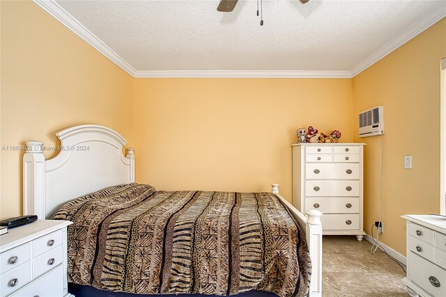 bedroom featuring ceiling fan, a textured ceiling, and crown molding