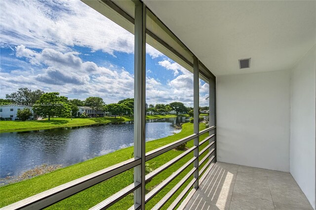 balcony featuring a water view