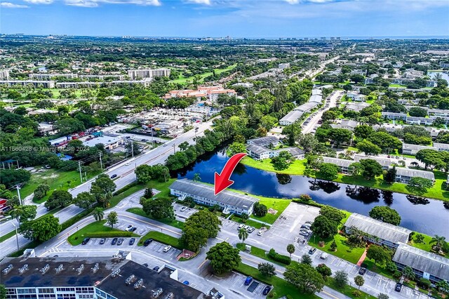 drone / aerial view with a water view