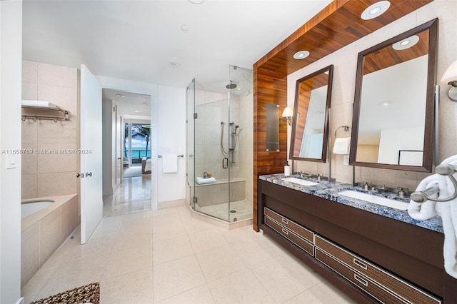 bathroom with vanity, shower with separate bathtub, and tile patterned flooring