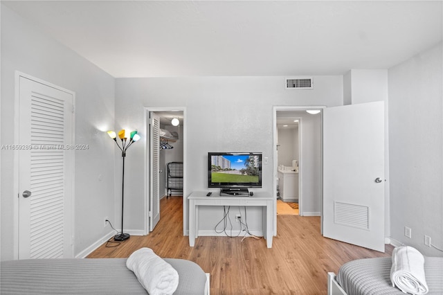 bedroom with light wood-type flooring