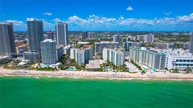 birds eye view of property featuring a view of the beach and a water view