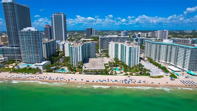 aerial view featuring a water view and a beach view