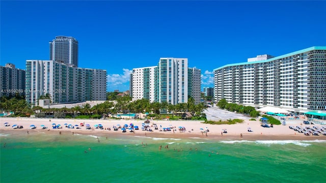 drone / aerial view with a view of the beach and a water view