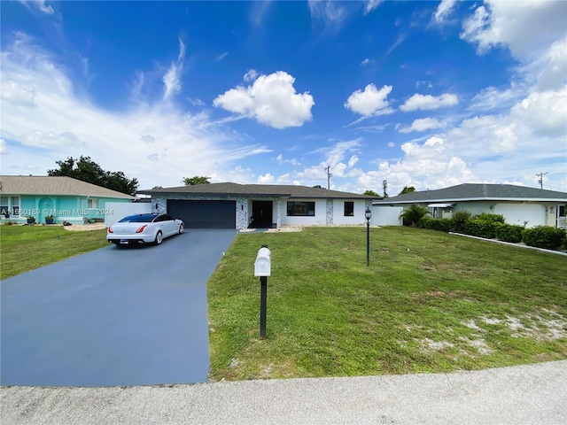 ranch-style house with a garage and a front lawn