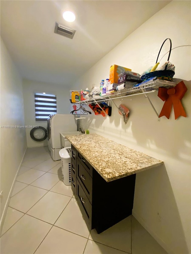 interior space featuring tile patterned floors, vanity, and toilet