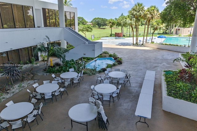 view of patio / terrace with a fenced in pool