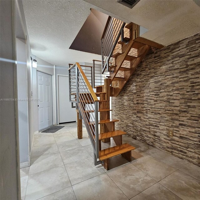 1182 W 37th Ter Unit 11, Hialeah, FL 33012 - stairs with a textured ceiling