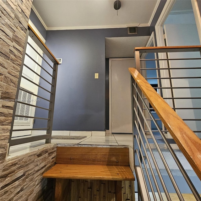 staircase with ornamental molding