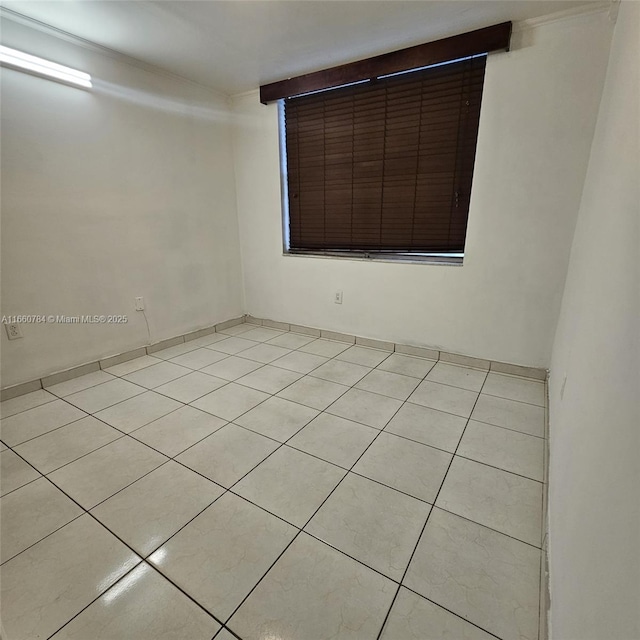 1182 W 37th Ter Unit 11, Hialeah, FL 33012 - unfurnished room with light tile patterned floors
