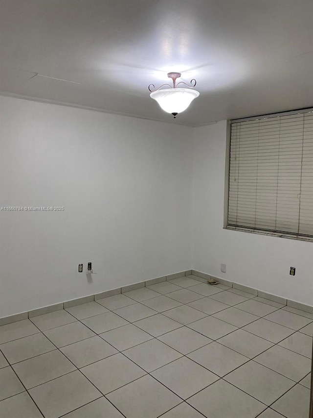 1182 W 37th Ter Unit 11, Hialeah, FL 33012 - spare room featuring light tile patterned flooring