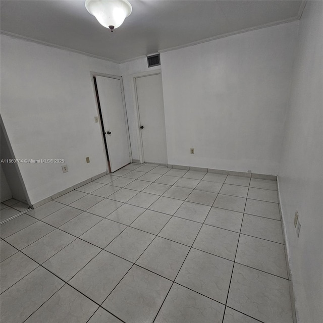 1182 W 37th Ter Unit 11, Hialeah, FL 33012 - spare room with visible vents and light tile patterned flooring