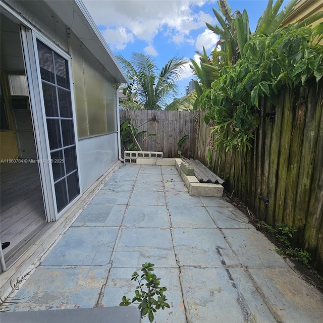 1182 W 37th Ter Unit 11, Hialeah, FL 33012 - view of patio featuring a fenced backyard