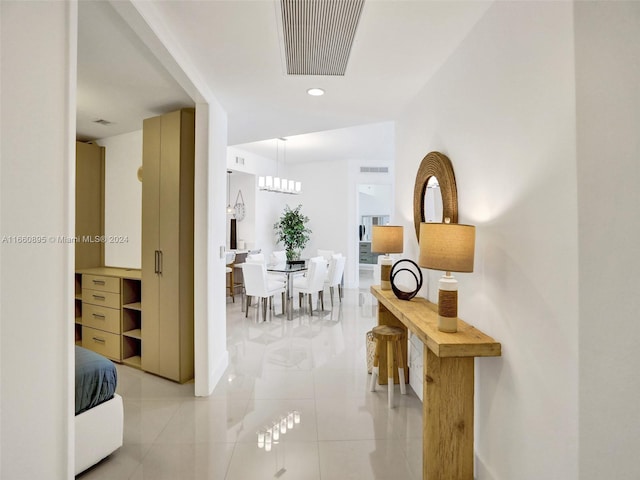 corridor featuring light tile patterned floors