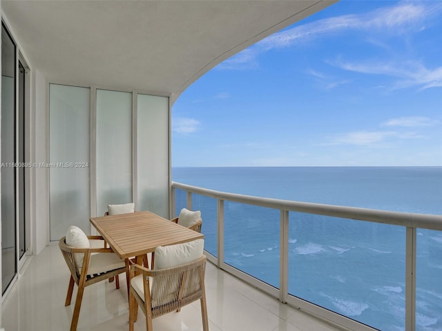 balcony featuring a water view