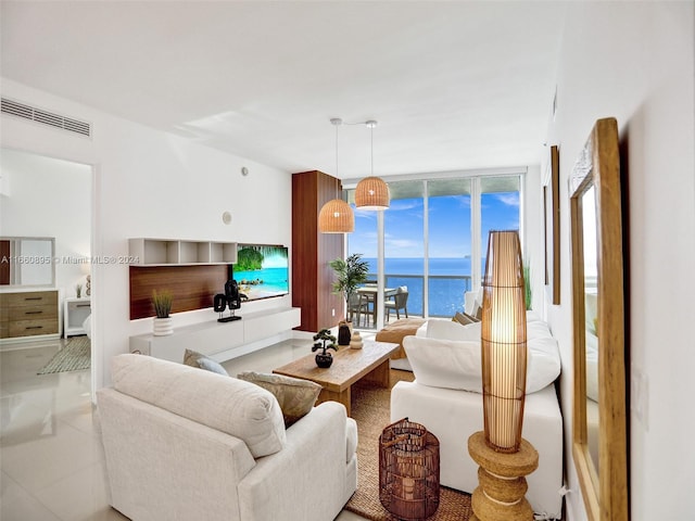 living room featuring light tile patterned floors and a healthy amount of sunlight