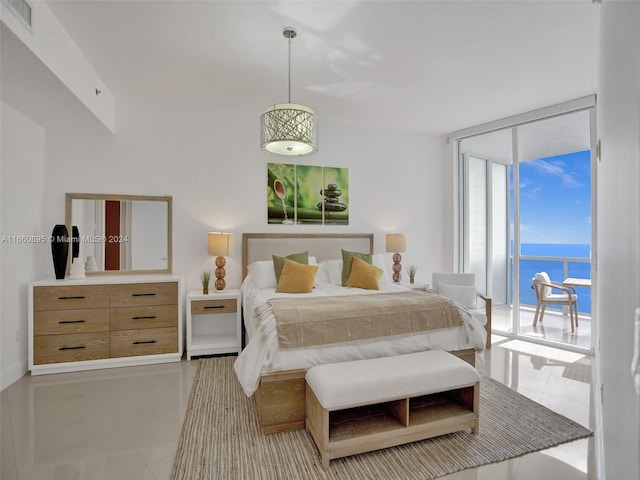 tiled bedroom featuring floor to ceiling windows, access to exterior, and a water view