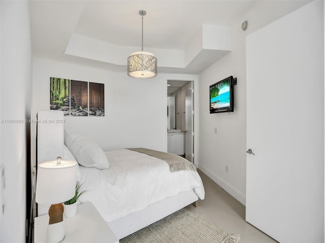 bedroom featuring a raised ceiling