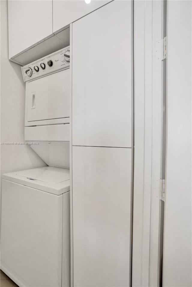 washroom with stacked washer and clothes dryer