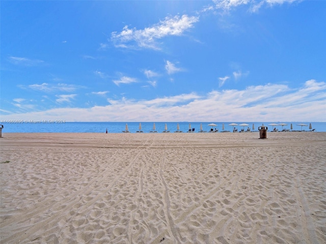 property view of water featuring a beach view