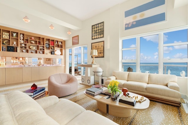 living area featuring a water view