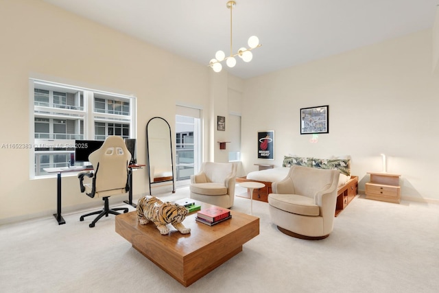 living room featuring carpet floors and an inviting chandelier