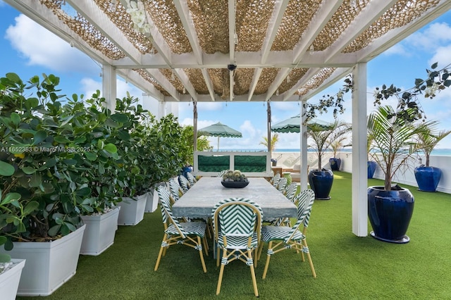 view of patio / terrace with outdoor dining area, fence, and a pergola