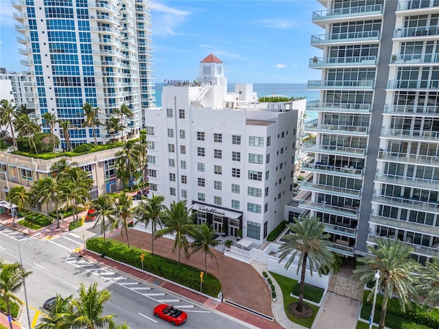 view of building exterior featuring a view of city and a water view