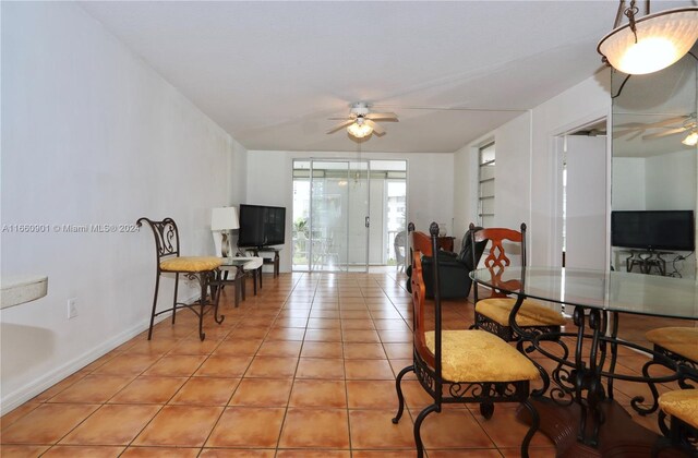 interior space with ceiling fan