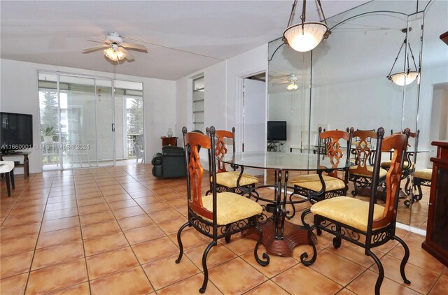 dining space featuring light tile patterned floors and ceiling fan