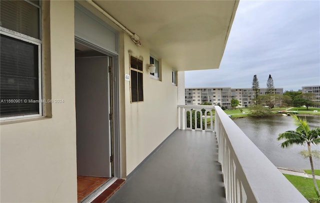 balcony featuring a water view