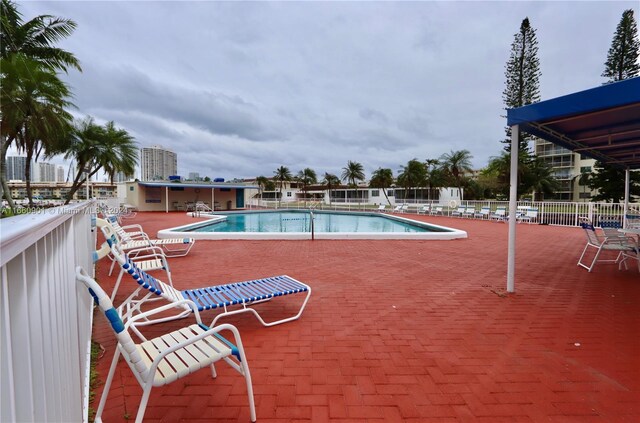 view of swimming pool with a patio