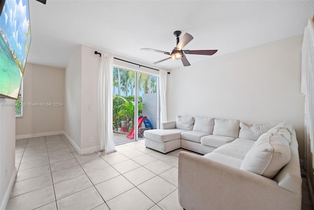 living room featuring ceiling fan and light tile patterned floors